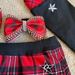 Cheer Uniform designed by Rebel! Under piece is YS, skirt YM. Fits like youth sm